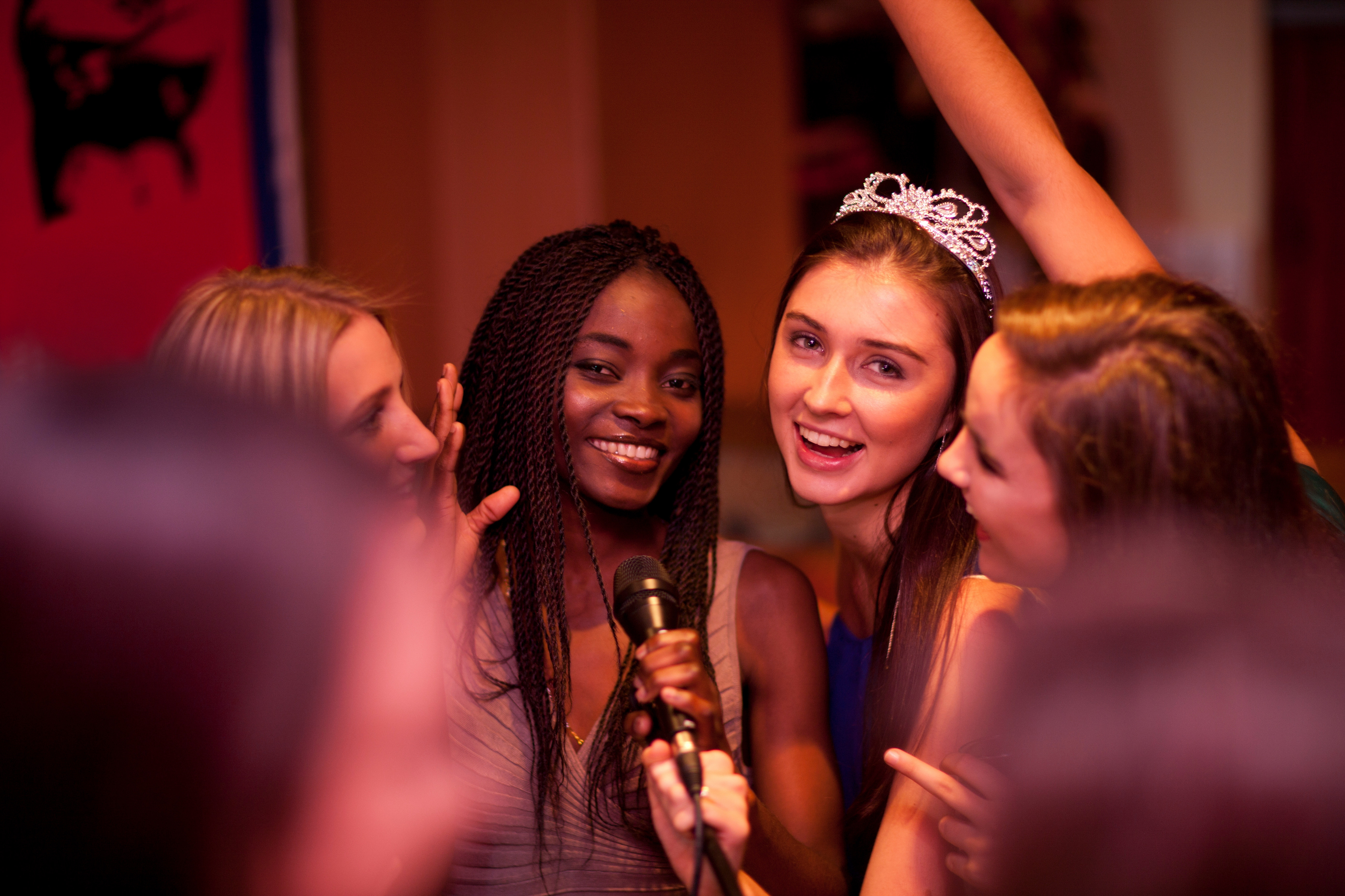 Group of girls singing karaoke 